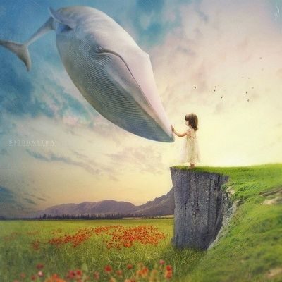 garota sonhando com mudança de vida em forma de baleia branca gigante